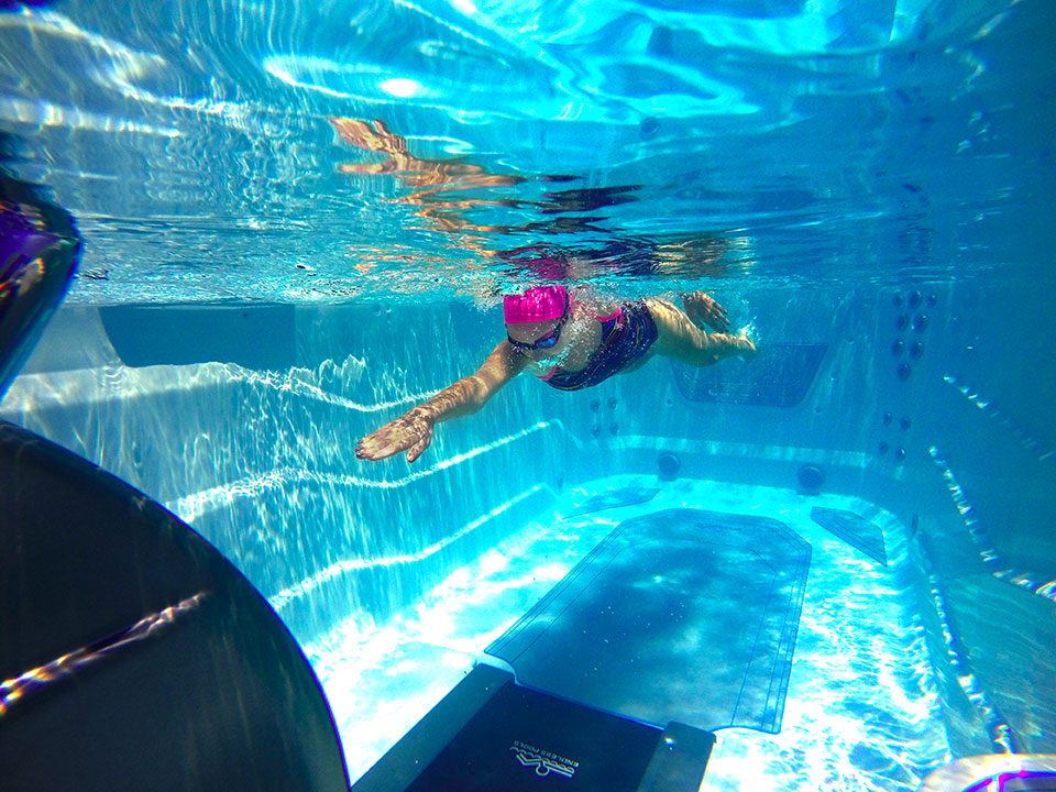 Swiming in place in the E550 Endless Pools® Fitness System