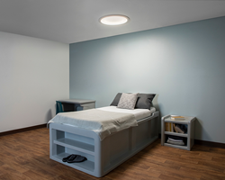 Symmetry 23" luminaire above a behavioral health bed