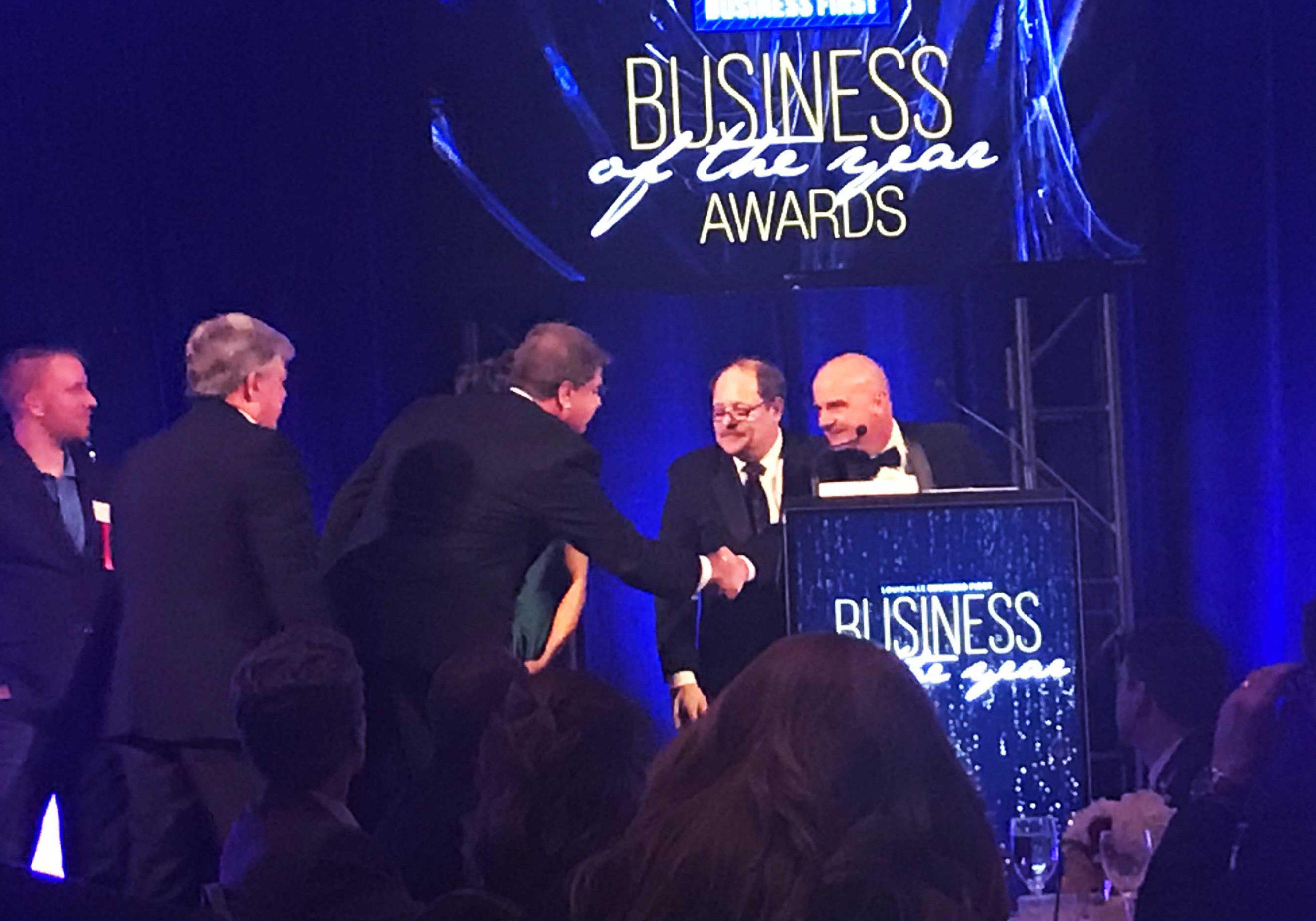Miles Lee accepts the "Business of the Year" award in December 2018