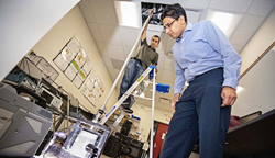 WPI professor Nikhil Karanjgaokar conducts an experiment to observe how waves move through granular materials immersed in liquid, which could be used for shock protection.