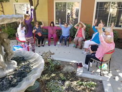 Cypress Place residents exercising with instructor