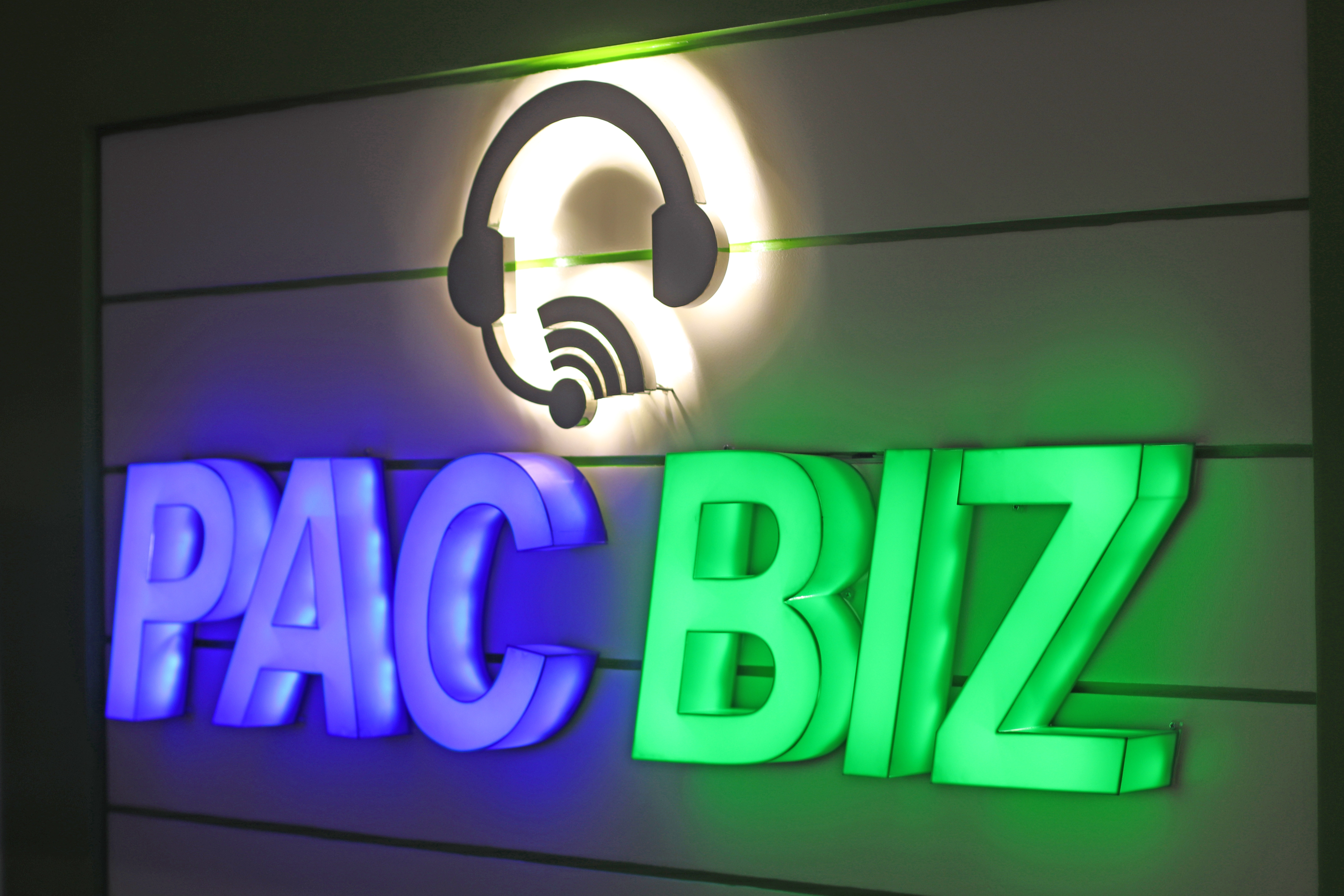 Pac Biz's illuminated logo greets visitors when they come into the receiving area of the new Pac Biz office