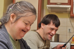 Two older adults with Down syndrome cooking