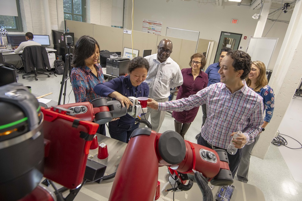 WPI researchers conduct a gripping-related experiment with the Baxter robot.