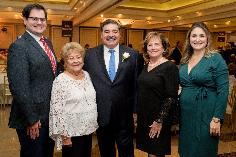 Corporate Partner Award honoree Daniel Molino from Grassy Sprain Longterm Care, Inc. (center) with his family and friends. (Photo by: Eric Vitale Photography)