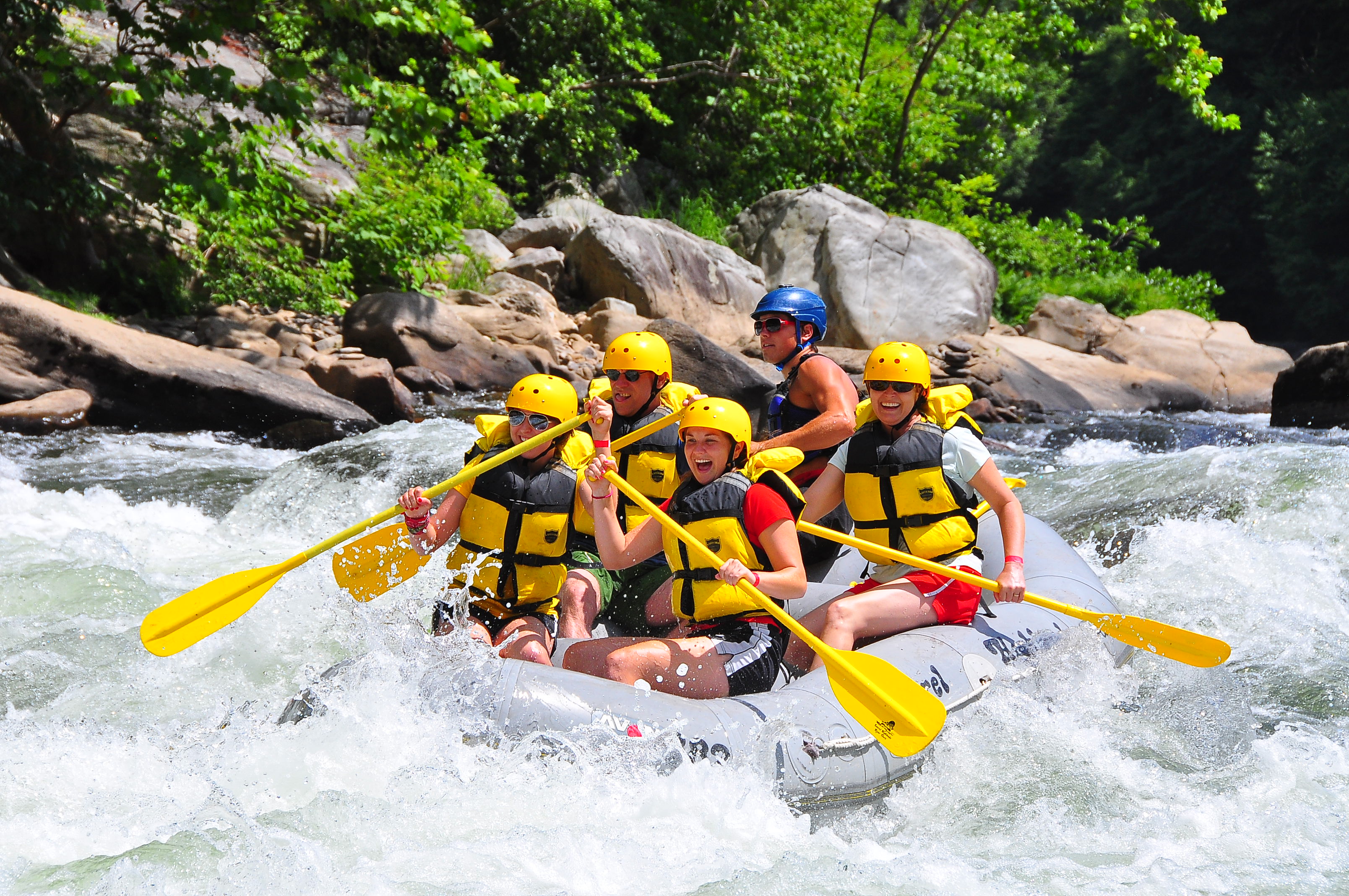 A group of rafters enjoying the adrenaline rush of whitewater rafting on the Youghiogheny River