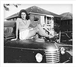 Current Texas Iron & Metal owner Max Reichenthal’s mother sitting on the hood of the Chevrolet pick-up truck that started it all.