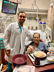 Patient and doctor pose together after surgery.