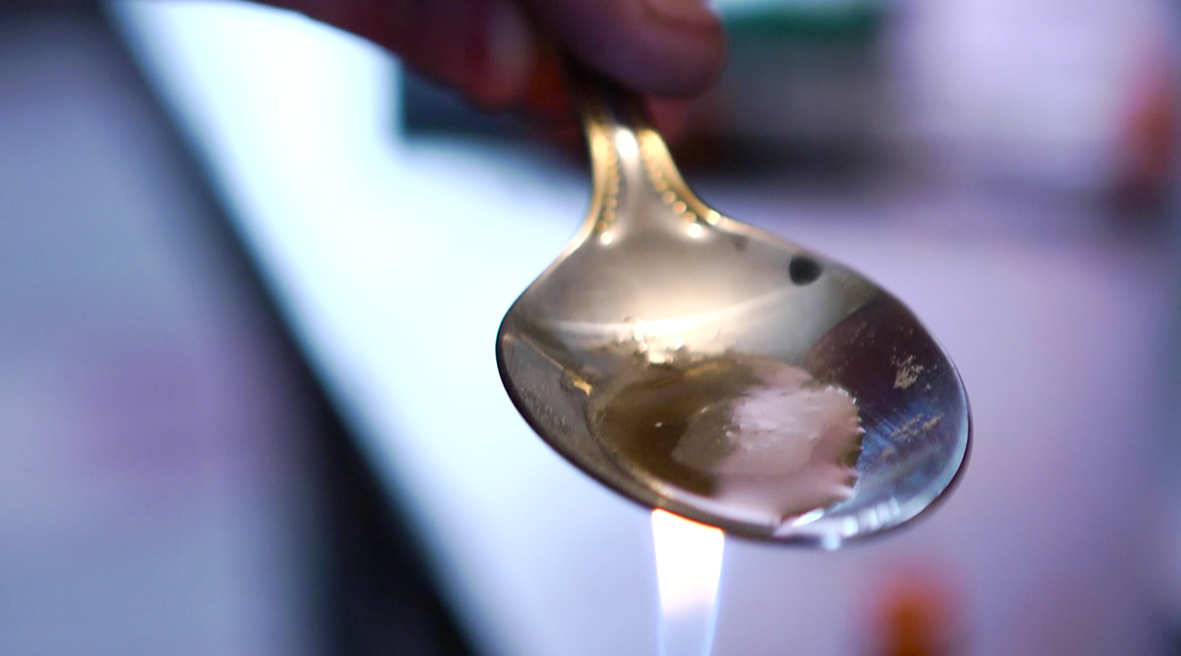 Screengrab from the film: Heroin is cooked and prepared for injection.