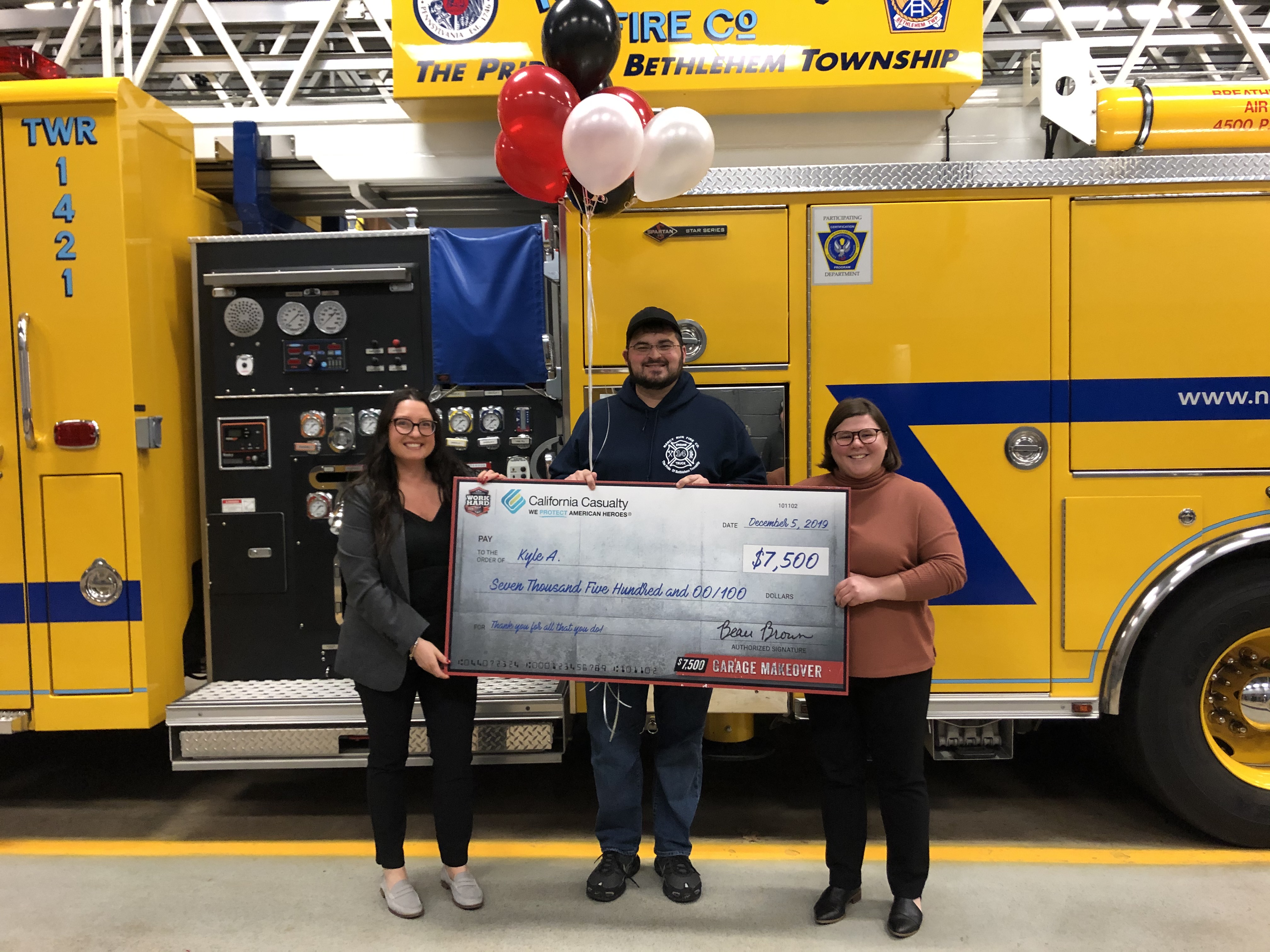 $7,500 Garage Makeover winner Kyle (center) with California Casualty's Bonnie Harber and Tara Stoudt