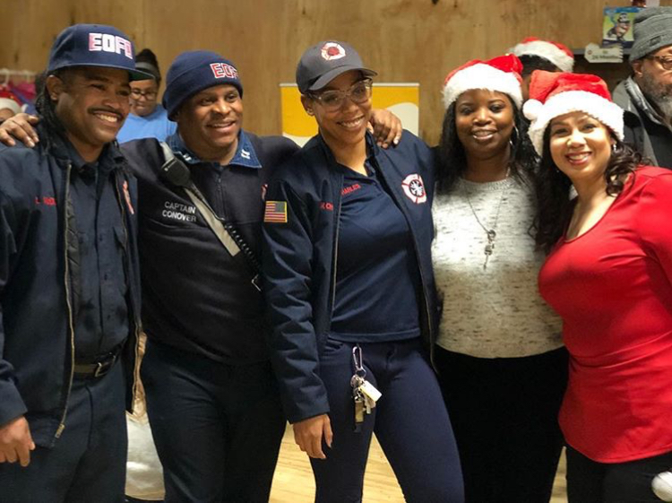 Attendees gather during ProudLiving Companiesu2019 2018 Coat and Toy Drive in East Orange, N.J.