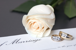 wedding rings on a certificate of marriage