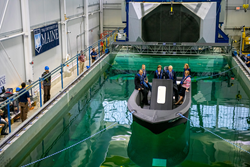 3D Printed boat 3Dirigo in pool with Maine congressmen aboard