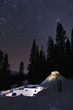 NOLS students sleep under the stars in self-built snow shelters on NOLS Wyoming backcountry expedition (photos by Brian Fable/ NOLS and Fredrik Norrsell/NOLS).