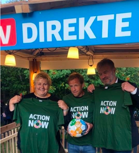 Norwegian Prime Minister Erna Solberg with the Action Now jersey