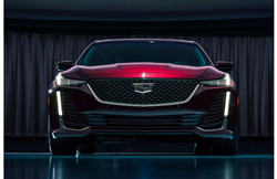 2020 Cadillac CT5 Premium Luxury exterior front shot with dark red maroon paint color showcasing grille and headlight design