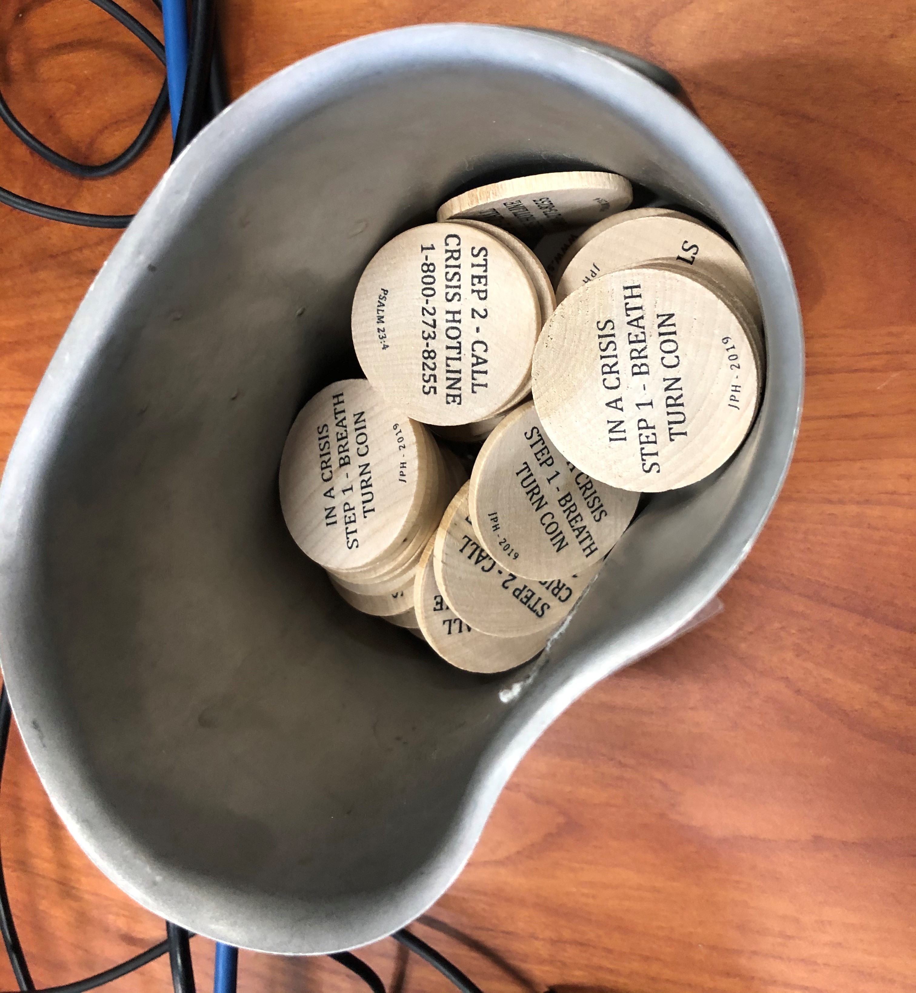 Wooden coins with crisis information are available for student veterans to take with them from the Veterans Success Center at Sierra College in Rocklin, California.