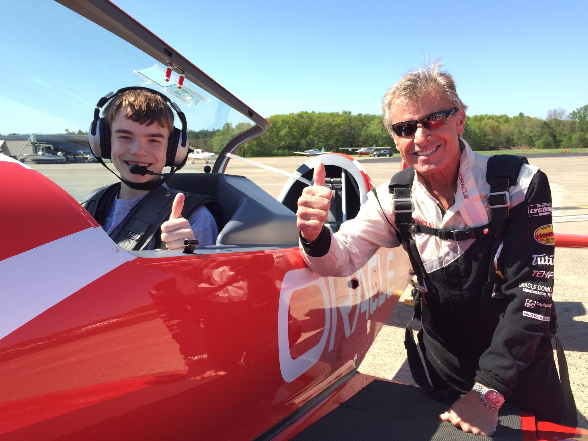 Airshow legend Sean D. Tucker (right), Young Eagles chairman, is all smiles with a newly flown Young Eagle after their introductory flight.