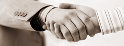 Sepia-toned picture of two people shaking hands