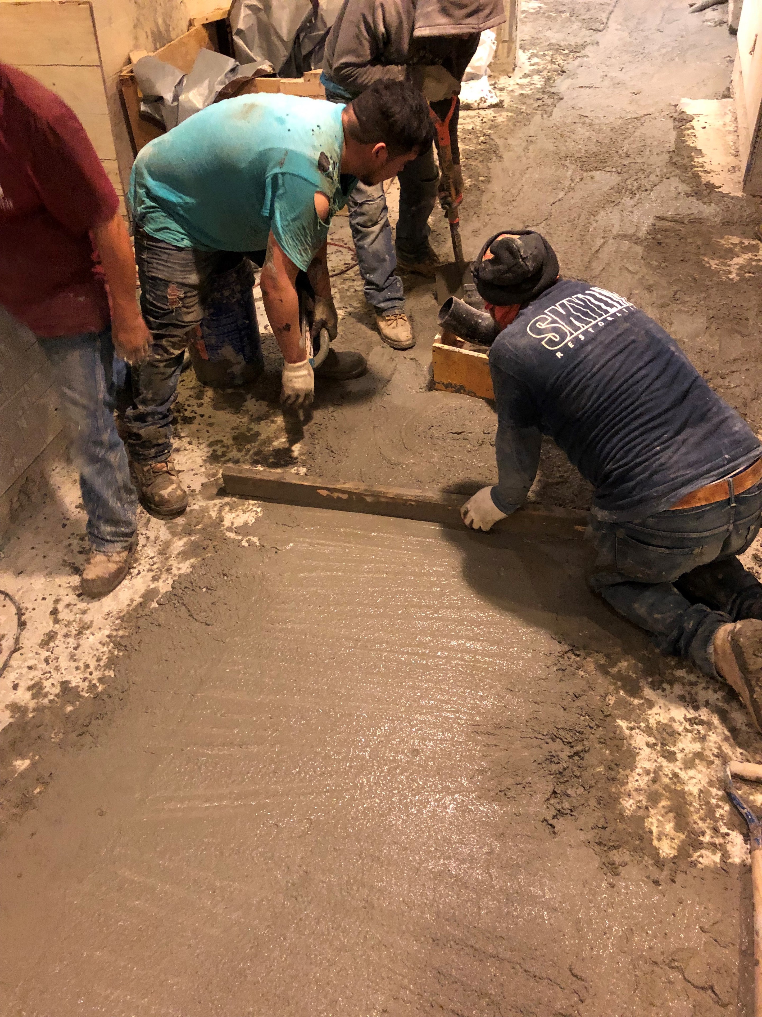 PSP finishes the job: LEVELINE 15, a self-leveling underlayment from PSP, was applied to the concrete basement slab to ensure a perfectly level surface for the final layer of ceramic tiles.