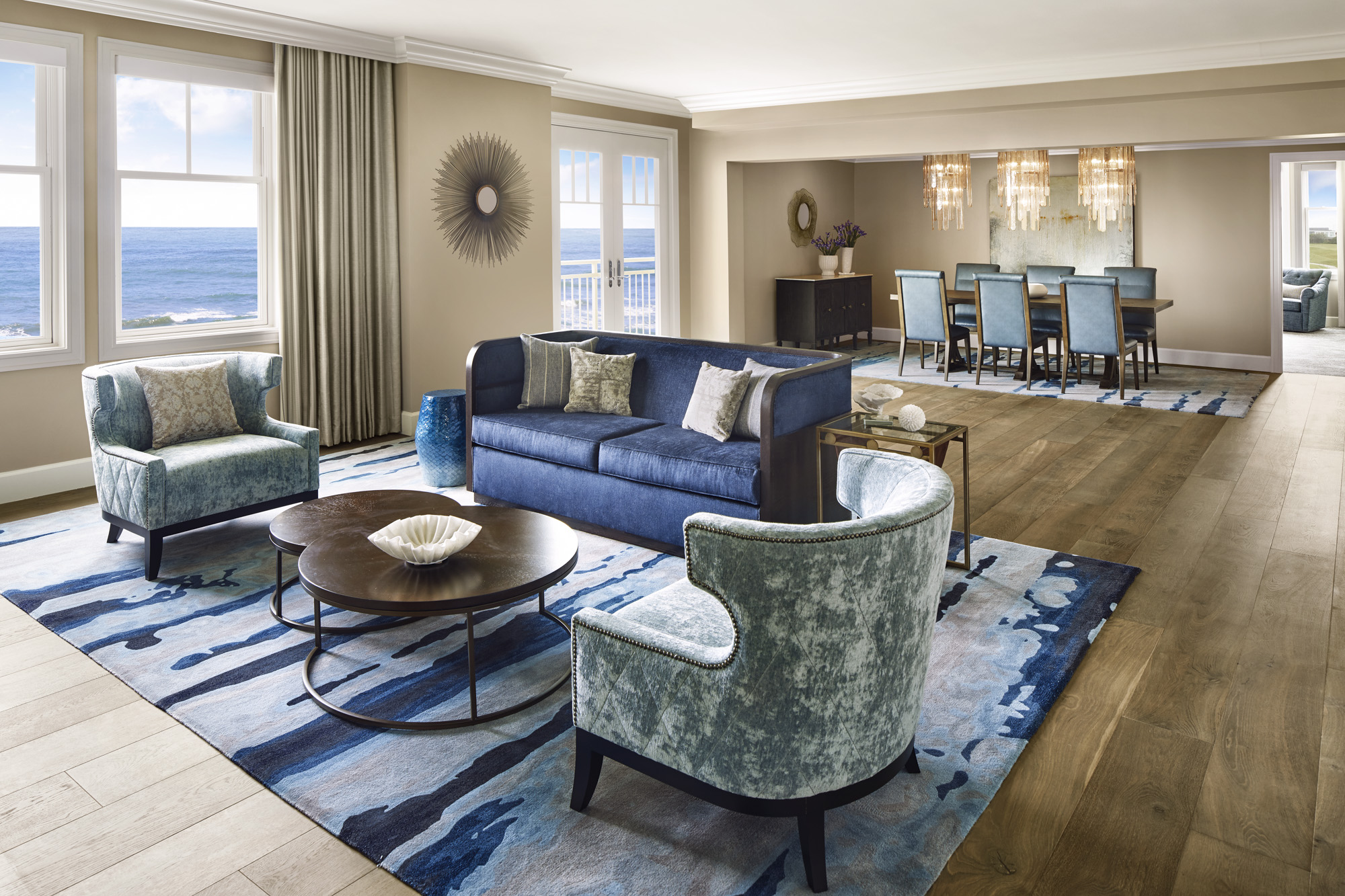 Oceanic Opulence welcomes guests in The Ritz-Carlton Suite featuring sweeping ocean views and a modern design boasting hues of warm resplendent blues and rich golds.