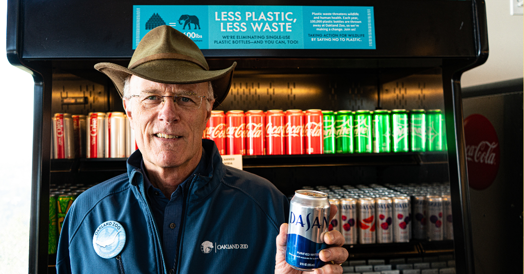 Dr. Parrott CEO/President of Oakland Zoo presenting a first-ever manufactured can of Dasani water at the Zoo