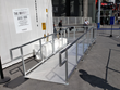 Wheelchair ramp at entrance to immersive experience in large container at Universal City Walk.
