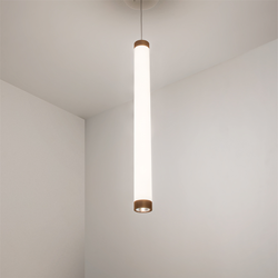 A luminous cylinder pendant with metal finishes and a downlight