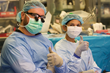 r. Christopher DeMassi and Dr. Daxa Patel give the thumbs up after completing robotic surgery for an epilepsy patient
