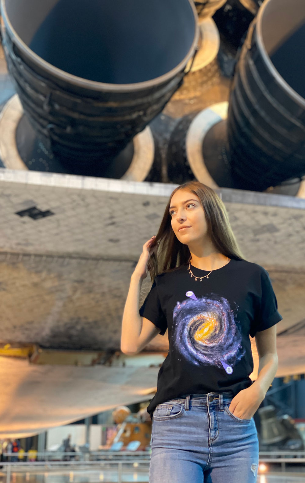 This Svaha black, short-sleeve unisex adult t-shirt features a witty astronomy-inspired design called “We will be there” showing that in a few billions years, we might be on a new Earth-like planet.