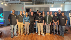 Fox Music House operations manager Joseph Fox, center, holds the dealership's Yamaha 2019 Dealer of the Year award for the Southeastern region, surrounded by Fox Music House's team.