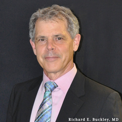 Earlobe repair surgery by Dr. Richard E. Buckley