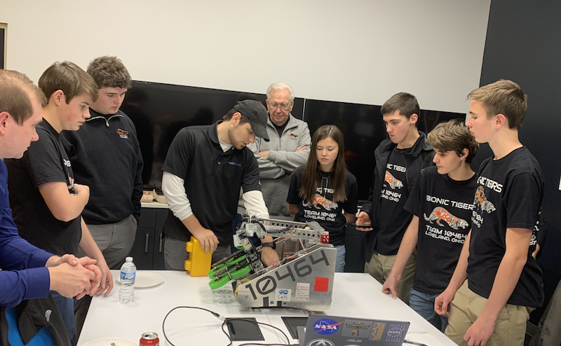 Kinetic Vision's Adam Ogg and Joe Moeller mentoring Loveland High School's Bionic Tigers on their robot