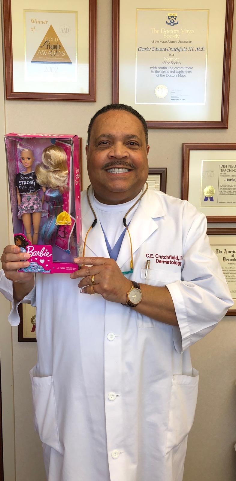 Charles E. Crutchfield III, M.D. with his Fashionista Barbie Doll with alopecia.