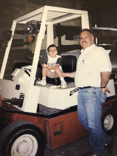 Danny (left) spending his summers as a young boy at B&B Door Company with his father Celso (right).