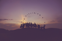 New Alliance Academy, Paramus NJ students throwing their graduation caps in the air