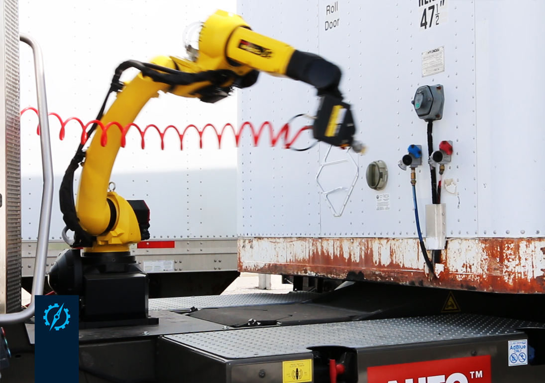 Robotic arm connects glad hand to enable air break system.