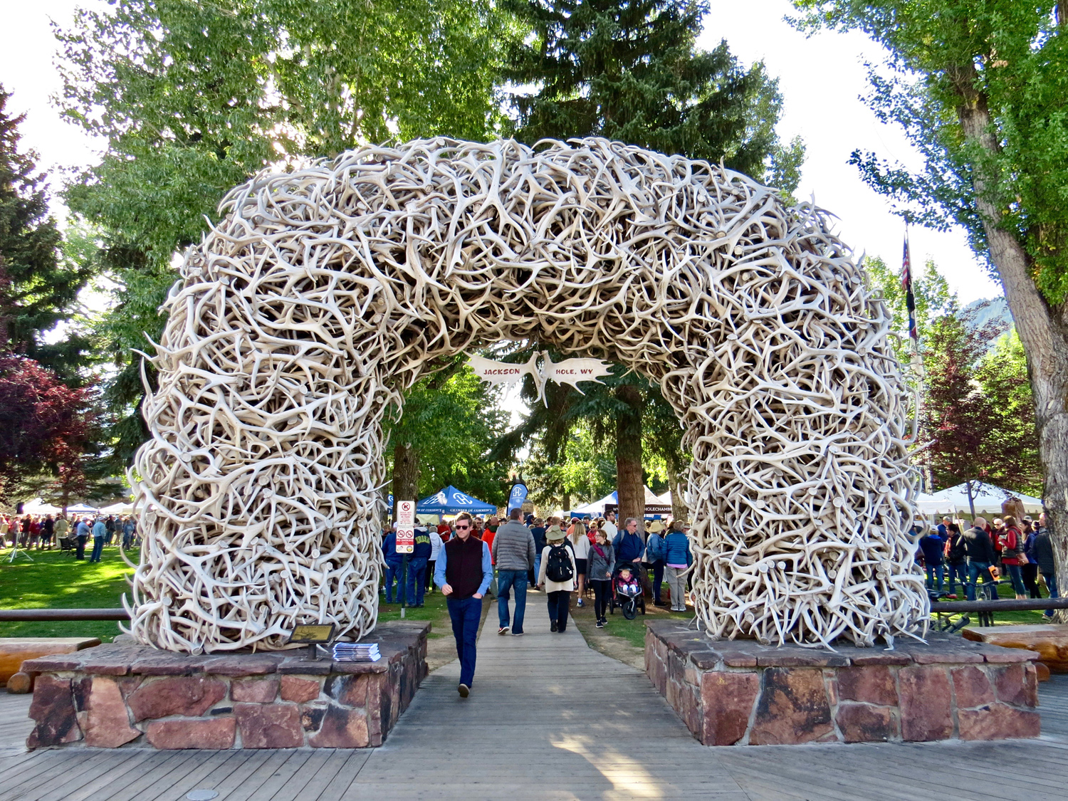Jackson Hole’s famous Town Square, framed with elk antler arches, is the location of many Fall Arts Festival events in the heart of downtown Jackson, Wyoming.