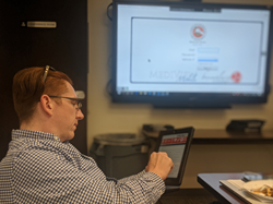 Terrence McGregor, Coordinator for the Health Programs COVID-19 Operations Center at Los Angeles County Fire, navigates the MEDIVIEW TRIPS software program