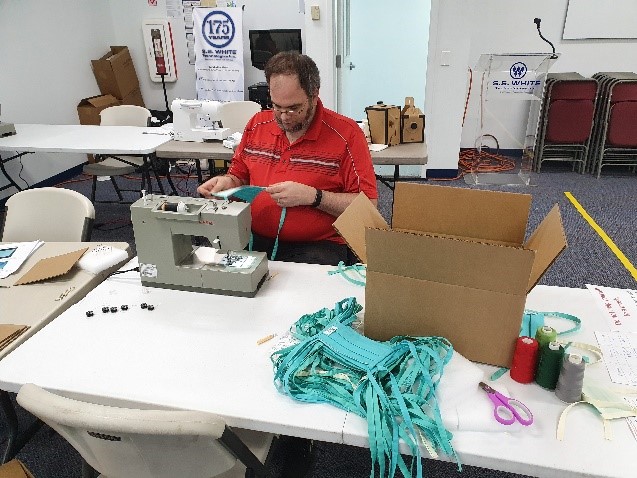 Ben Turner, CNC Associate, perfecting his sewing skills one mask at a time