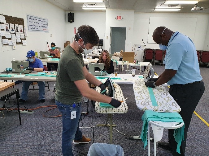 From left to right: Brian Servedio, Product Design Engineer and Sam Prescod, Planning & Purchasing Manager lending a hand at the ironing station