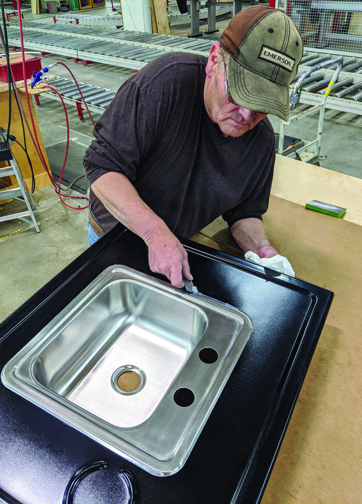 A Jonti-Craft employee, Steve Hay, shown assembling a Jonti-Craft® Clean Hands Helper Portable Sink to fulfill an order.