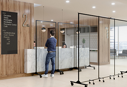 clear room dividers in front of a reception desk