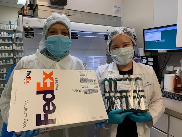 Nevine Khedr, CPhT Supervisor (left), and Pharmacist Ann Shin (right) mailing hand sanitizers to Hoboken Police Force to stay safe while on-duty during COVID-19 pandemic.
