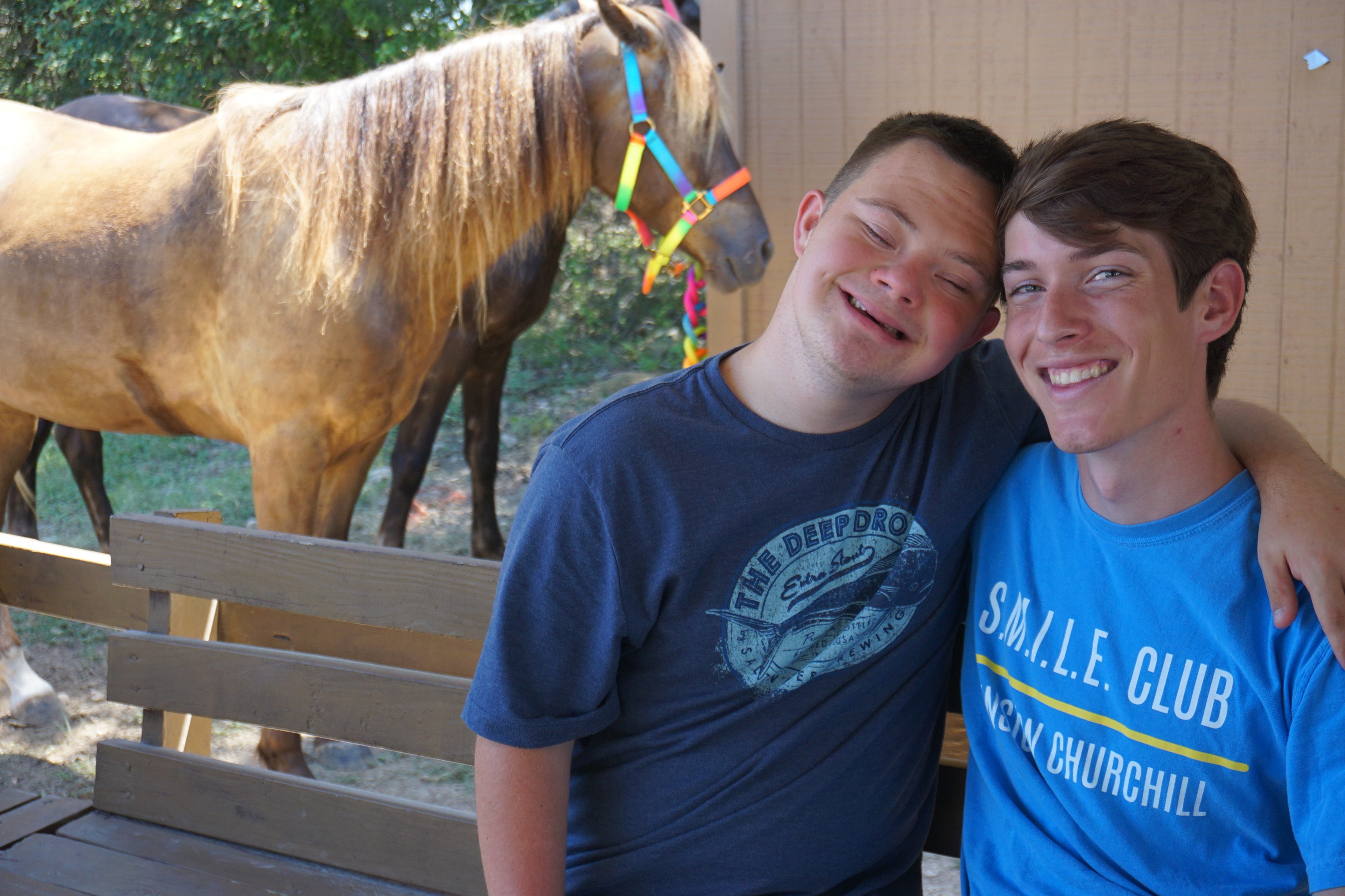 Camper Halen Akins with a CAMP volunteer