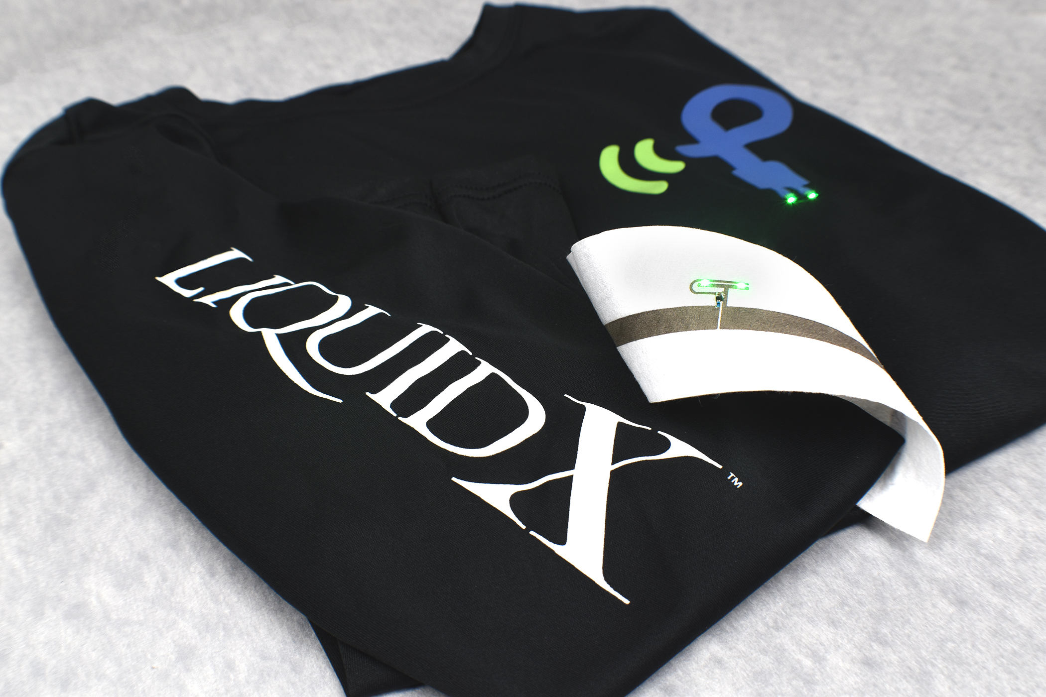 Manufacturers can integrate wireless charging electronics into garments using Liquid X’s conductive inks to print circuitry on fabric, mount components onto printed traces, then apply an encapsulant.