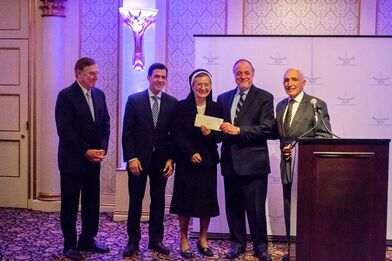 Savoy Foundation President Joseph Sciame (far right) Presents Grant Check to Sister Seline Mary Flores, C.S. JB, CEO of Providence Rest at the May 1, 2019 Providence Rest Gala Dinner