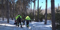 Paramedics carry out a search and rescue exercise conducted with a small UAS piloted by operators utilizing Kongsberg Geospatials IRIS Airspace Management software for advanced situational awareness.