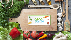GenoPalate's genomic DNA home collection kit for personalized nutrition analysis on a cooking board with whole foods in a kitchen