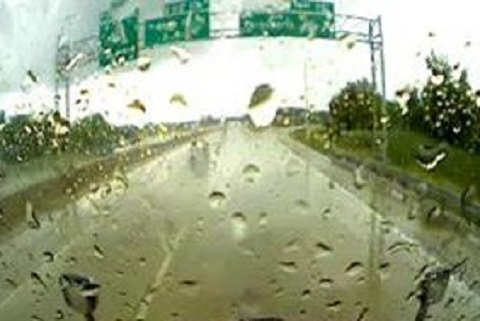 Rain builds up on a vehicle's windshield